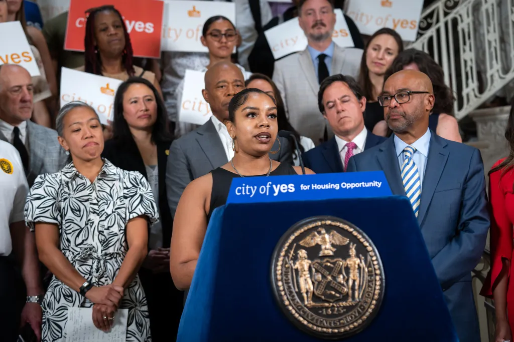 Queens homeowner Sadé Singh speaks at a City Hall ADU rally with Mayor Eric Adams, August 2024.