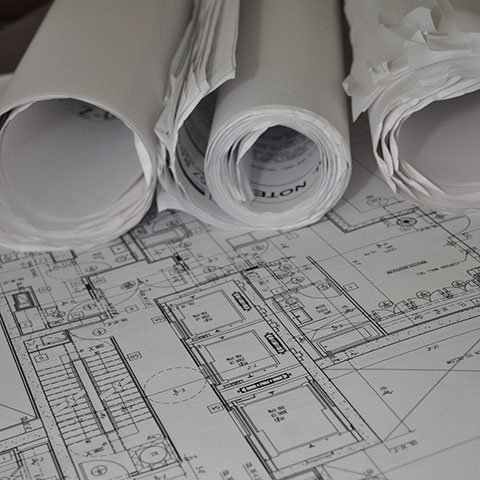 Rolled architectural plans, representing a DOB permit filing