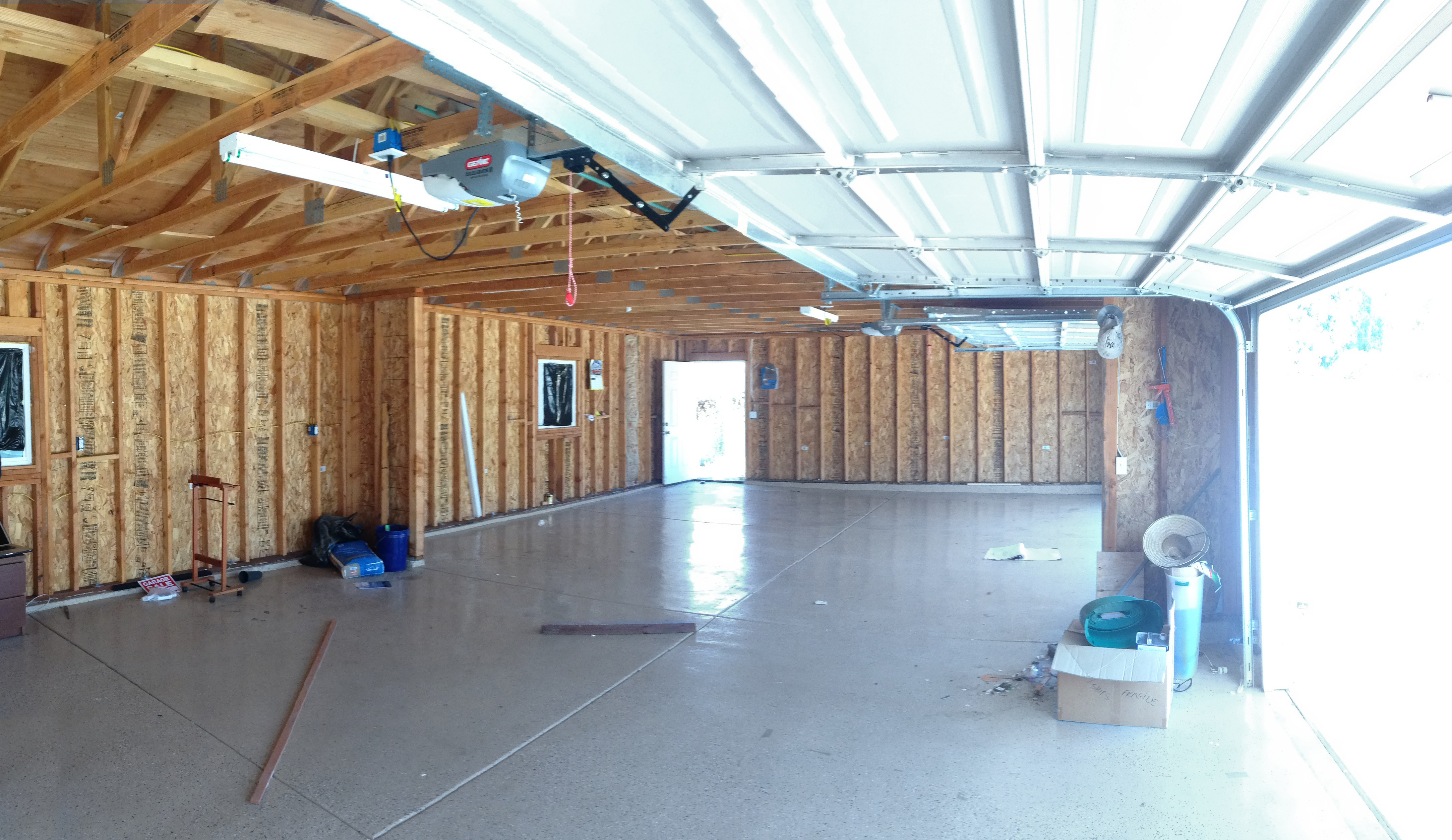 An A-framed core holding the kitchen and bathroom inside the converted garage ADU