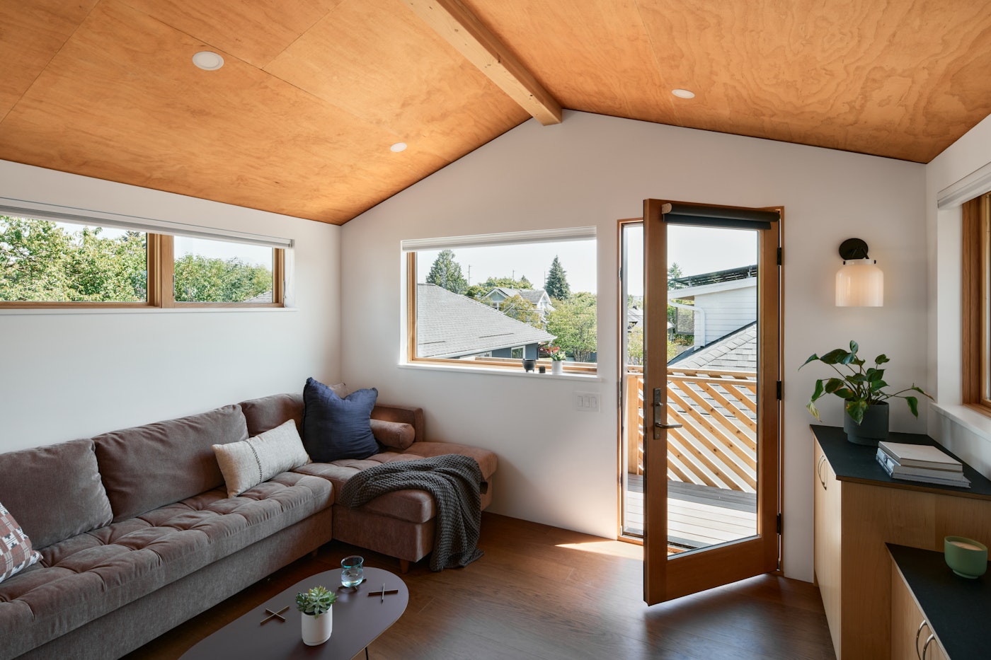 Interior of a compact Seattle Ballard backyard cottage with warm wood finishes