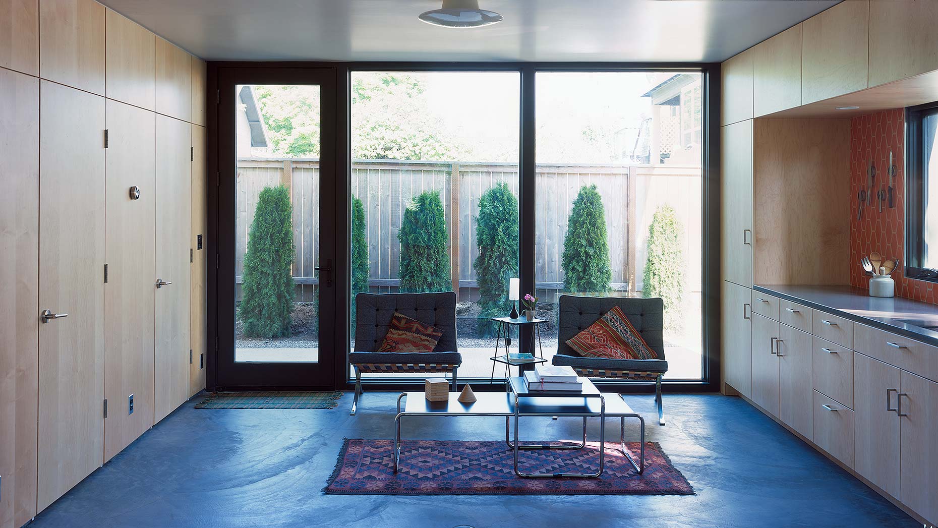 Interior of the Garden House ADU in Portland, showing a compact upstairs bedroom under a pitched roof