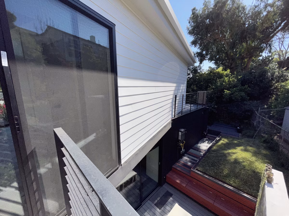 An outdoor patio and deck area attached to a modern Los Angeles accessory dwelling unit