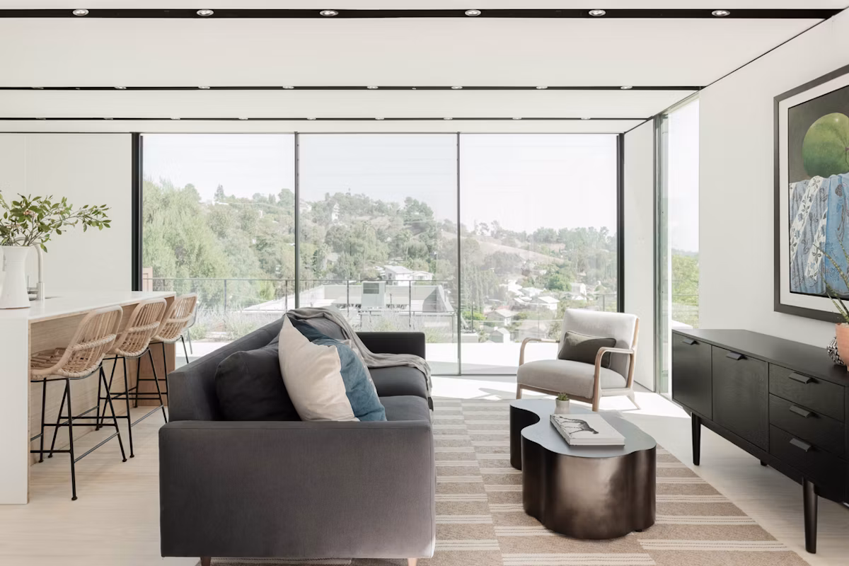 Interior of the Highland Park Cover ADU with floor-to-ceiling windows and neutral finishes